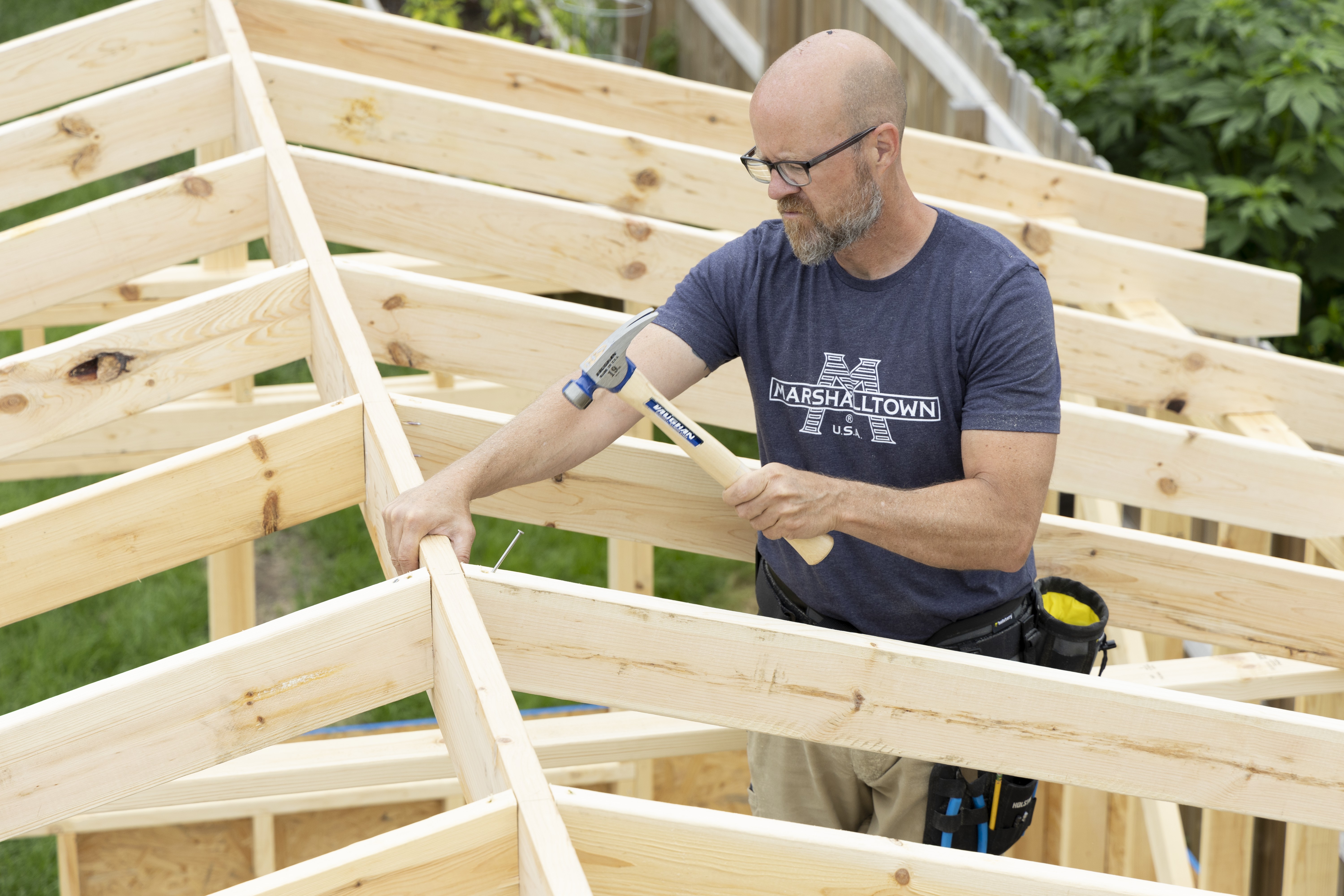 man building a roof